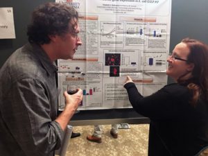 Beth and Chris discussing details of gene regulation (2017 Mid-Atlantic Microbial Pathogenesis Meeting)