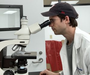 Michael Kovacs at microscope